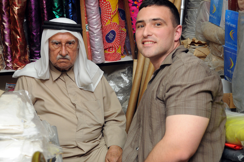 Dustin and Mohammad Saleh Nishwar at Souq Waqif in Doha, Qatar, March 8, 2010. Nishwar has sold merchandise at Souq Waqif for more than 60 years. The shop, packed with fabrics, clothes and prayer rugs, hasn’t budged in almost 100 years.